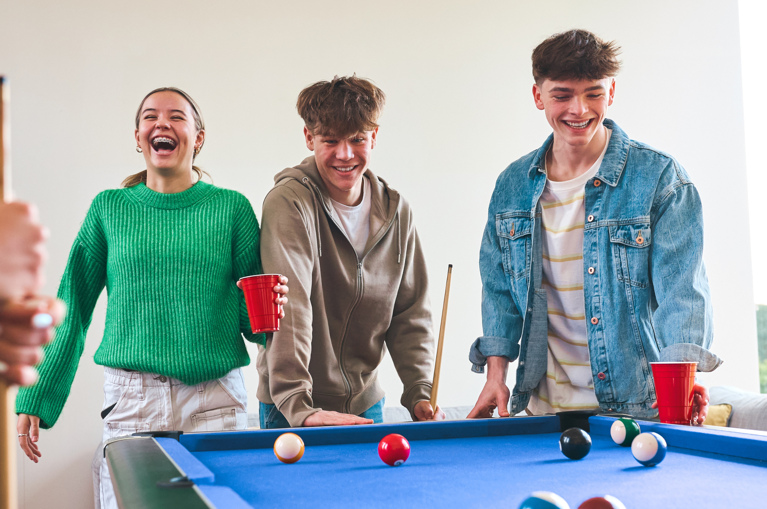 Young people playing snooker