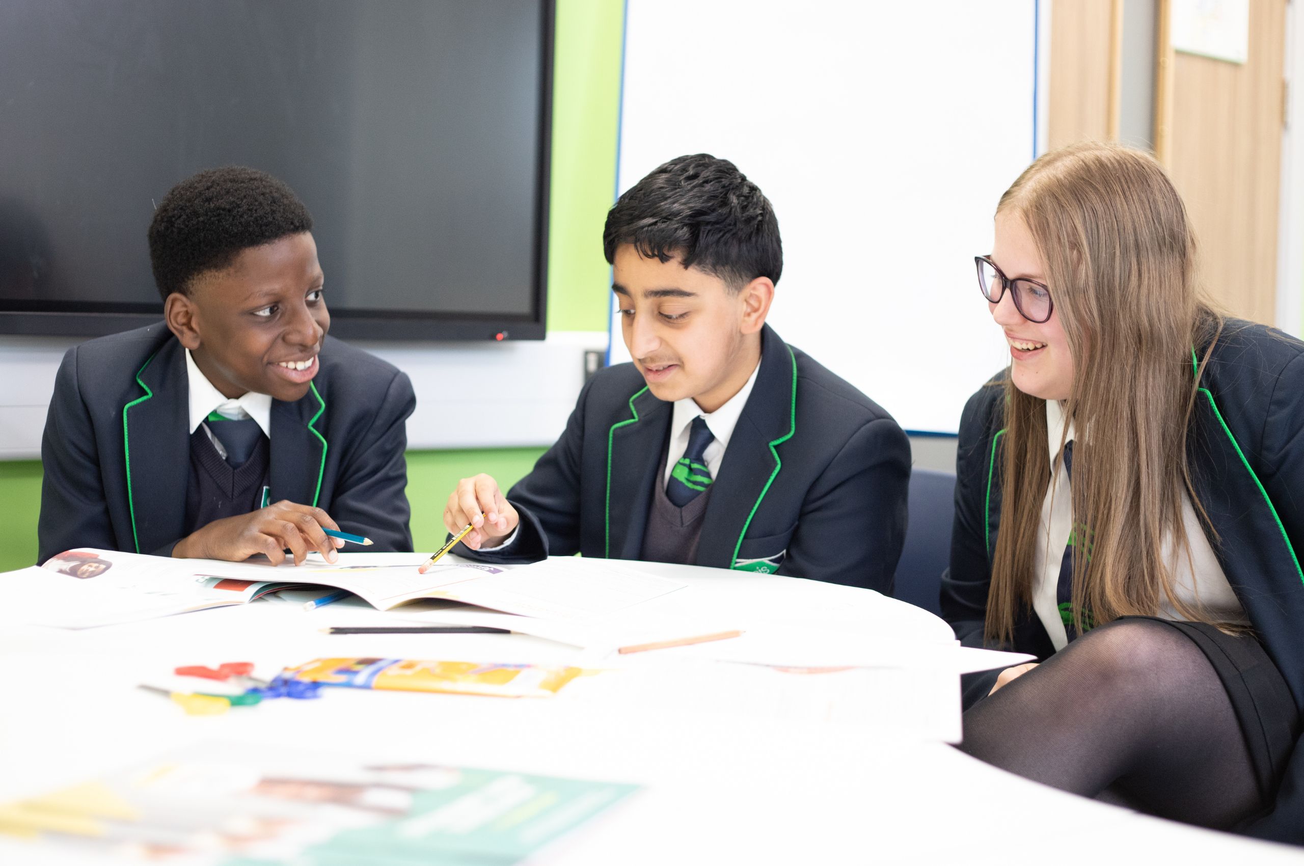 Three school children having a conversation