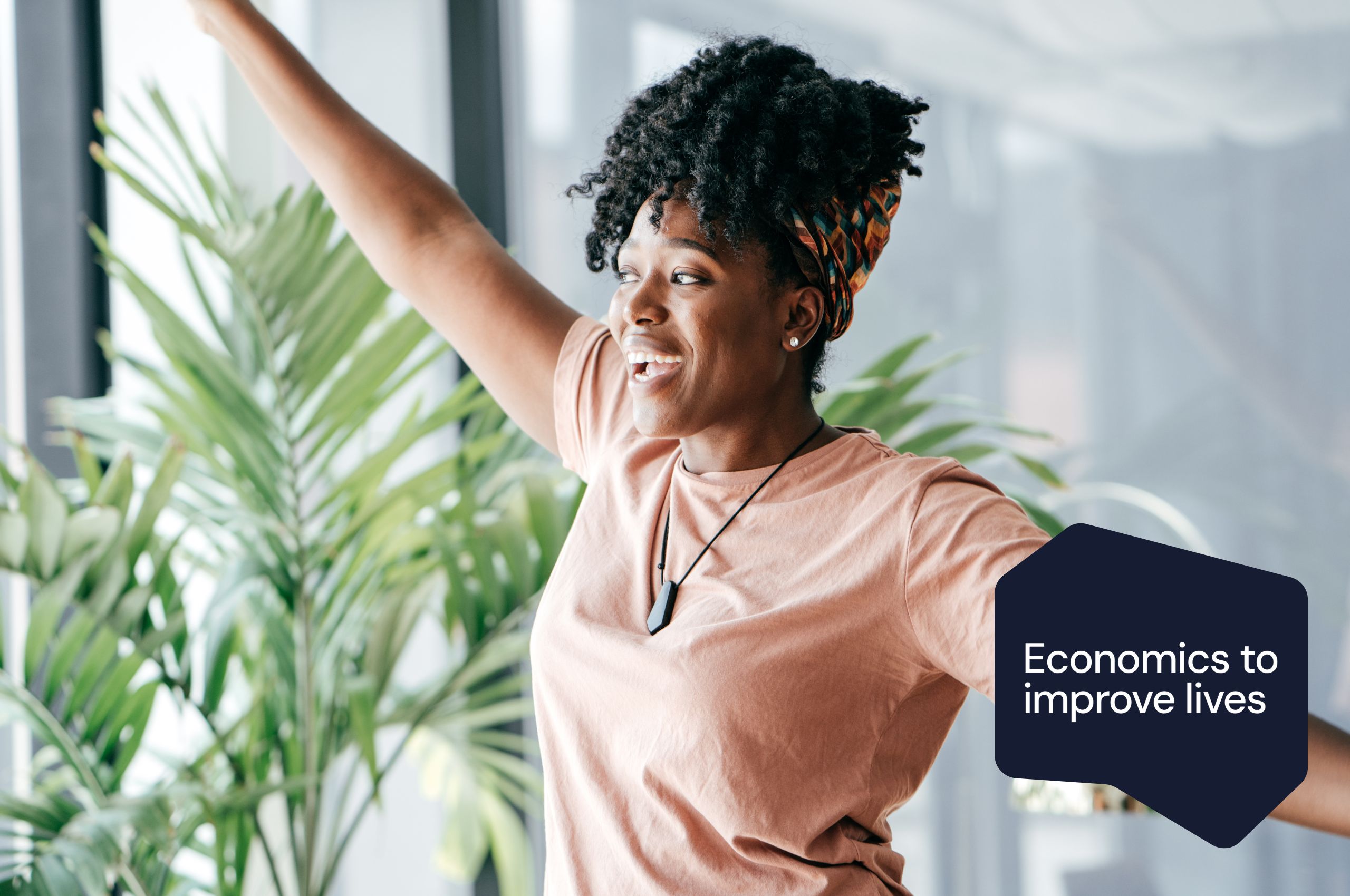 Happy woman stretching with an Economics to improve lives badge