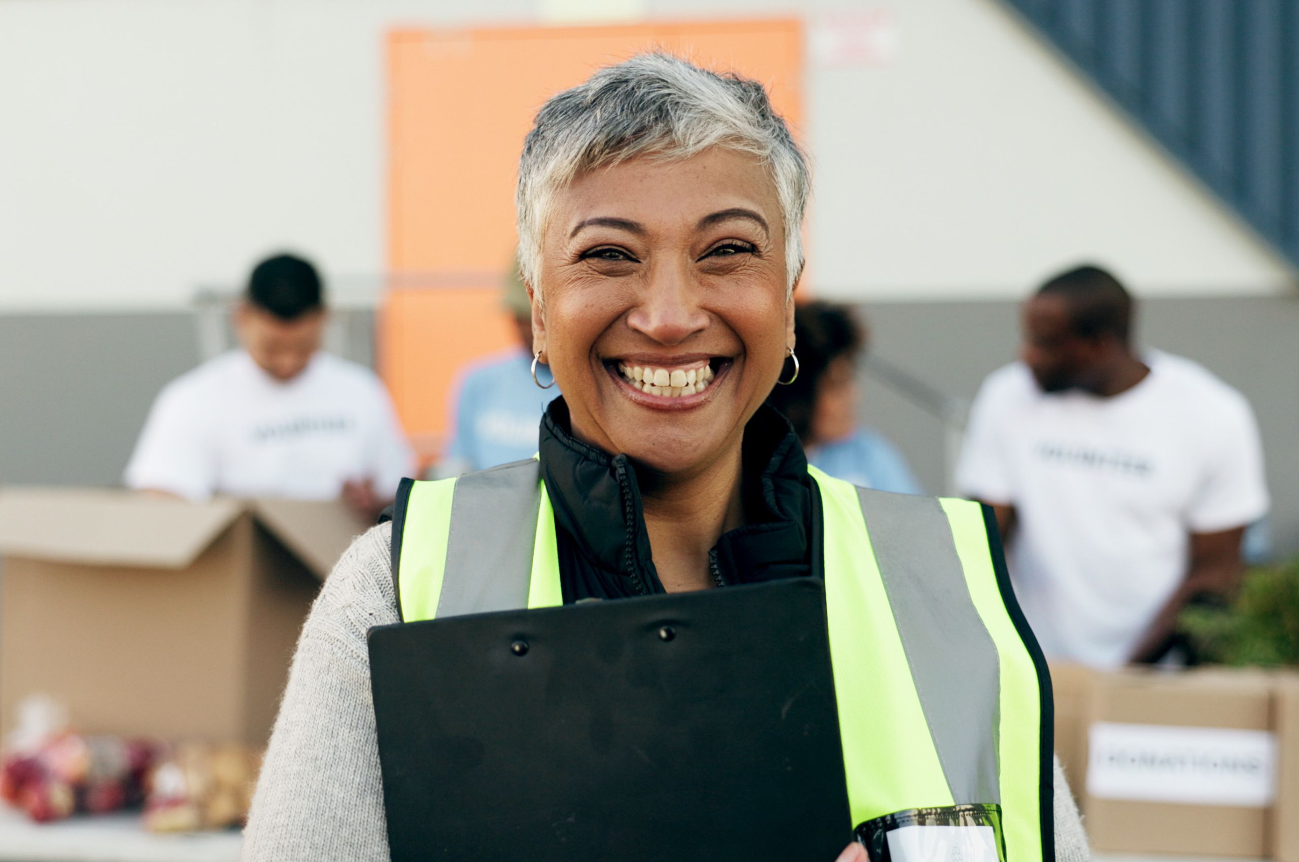 A volunteer holding a clipboard